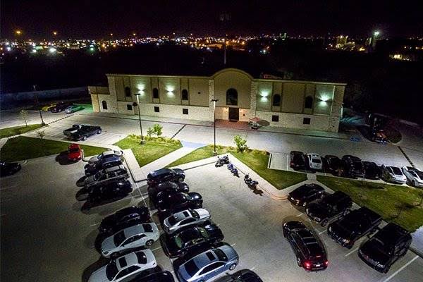 Aerial nighttime view of Bucks Wild Dallas and its illuminated parking lot